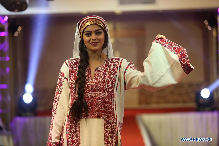 MIDEAST-NABLUS-FASHION SHOW-HERITAGE DRESS