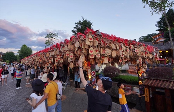 Tourists visit Lijiang Ancient Town in China's Yunnan